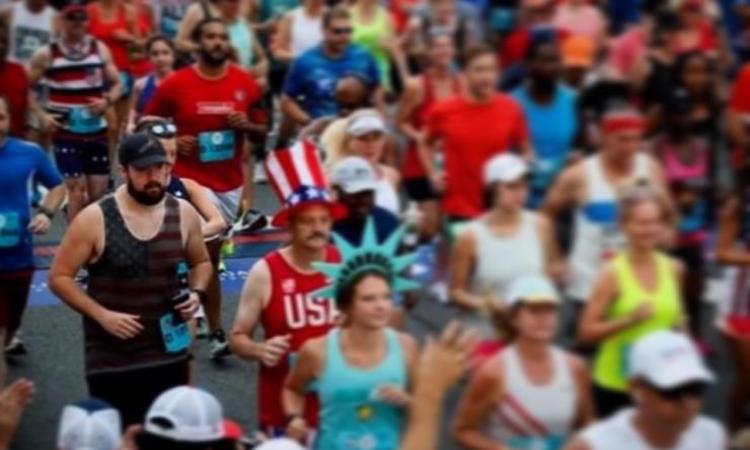 <p>Pierce (Pictured left in the American flag tank top) ran the Peachtree Road Race after spending weeks learning how to walk again.</p>