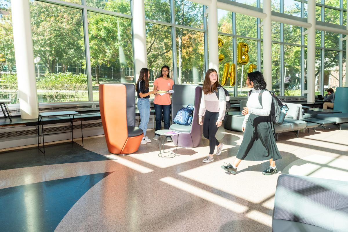 students walking in Ford atrium