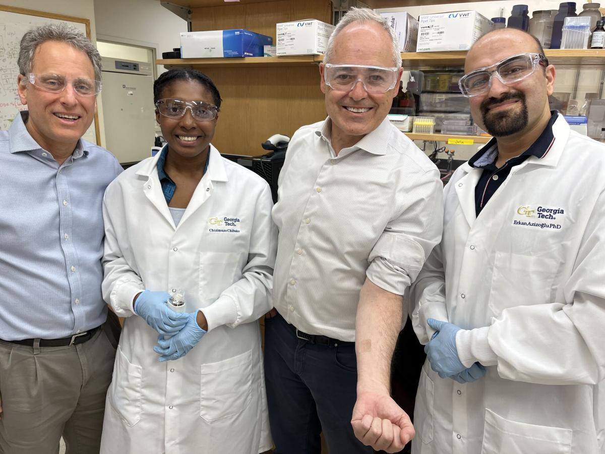 Mark Prausnitz with President Angel Cabrera and researchers